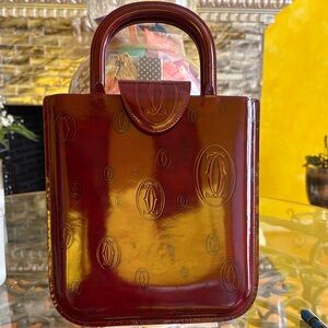 Elegant authentic Cartier Burgundy Designer Bag.